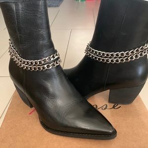 Beautiful leather boot with silver chain hardware.